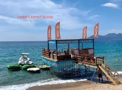 a lifeguard station on the beach with boats in the water at Appartement Pépite à Cannes in Cannes