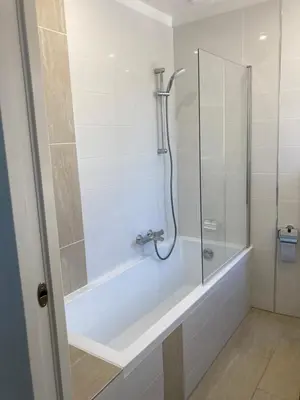 a bathroom with a shower and a bath tub at Cannes Beach Access, Private Room in Shared 3-Bedroom Apartment, Private Bathroom, Living Room with Sea View Suite Parentale salle de bain privée accès plages & vue mer du salon dans appartement partagé chez l'habitant in Cannes