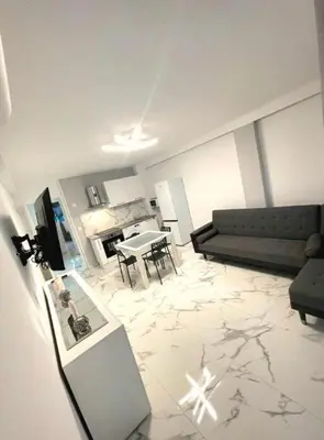 a living room with a couch and a table at Evasion Cannoise in Cannes