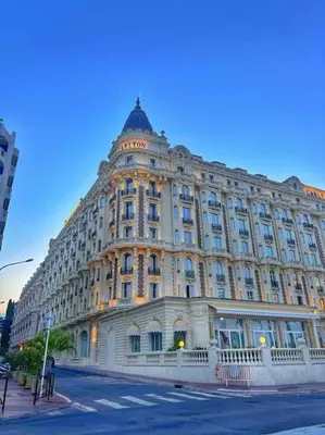 a large building on the corner of a street at Studio palais des festivals Croisette in Cannes