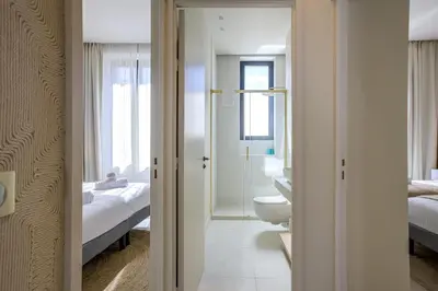 a bathroom with a sink and a toilet in a room at Jessicannes - ALBA - Plage et Palais des Festival à pied in Cannes