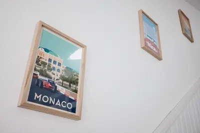 a picture of monaco on a wall with two pictures at Studio André - Palais & plage, clim in Cannes