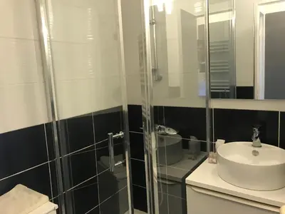 a bathroom with a shower and a sink at Résidence Palme d'Azur Cannes La Bocca in Cannes