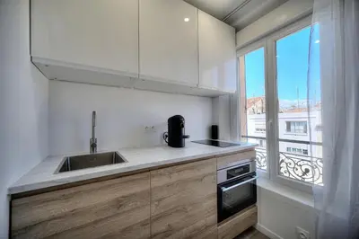 a bedroom with a bed and a skylight at Immogroom - Luminious T2 - Center - AC - Wifi in Cannes