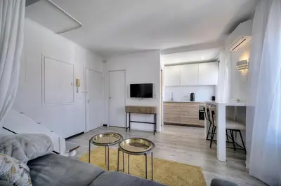 a bedroom with a bed and a skylight at Immogroom - Luminious T2 - Center - AC - Wifi in Cannes