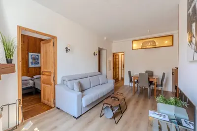 a living room with a couch and a table at FRGK Suquet Olivier Historic 2-3 BR Charm UltraFast WiFi in Cannes