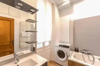 a bedroom with a bed and a walk in shower at FRGK Suquet Olivier Historic 2-3 BR Charm UltraFast WiFi in Cannes