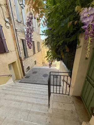 a bedroom with a large white bed in a room at FRGK Suquet Olivier Historic 2-3 BR Charm UltraFast WiFi in Cannes