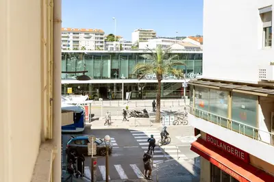 a view of a city street with people and a building at Elegant 2 rooms in the heart of Cannes in Cannes