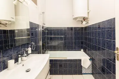 a bathroom with a tub and a sink at Elegant 2 rooms in the heart of Cannes in Cannes