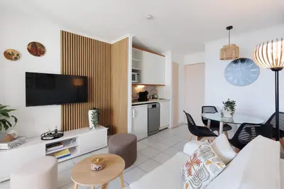 a living room with a couch and a table at Holiday Paradise in Cannes