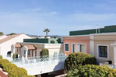 a view of a house with bushes and trees at Holiday Paradise in Cannes