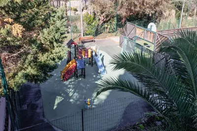 an overhead view of a playground with a slide at Holiday Paradise in Cannes