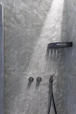 a shower with a shower head and a toothbrush at Lunique Maubourg - Next Hôtel Martinez - terrasse in Cannes