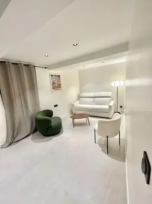 a living room with a couch and two chairs at Appartement cannes centre à 3 minutes du palais des festivals in Cannes