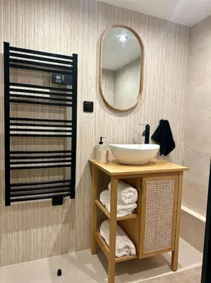 a bathroom with a sink and a mirror at Appartement cannes centre à 3 minutes du palais des festivals in Cannes