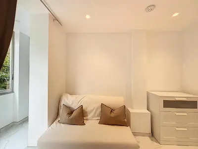 a bedroom with a bed with two pillows on it at Résidence Lacour in Cannes