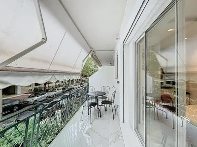 a balcony with a table and chairs on it at Résidence Lacour in Cannes