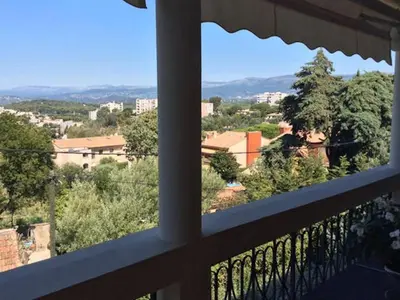 a view of a city from a balcony at Hibiscus in Cannes