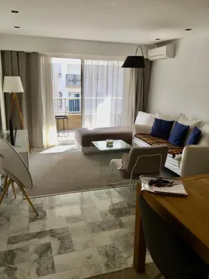 a living room with a couch and a table at center of cannes in Cannes