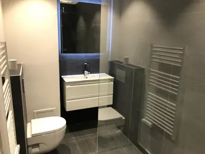 a bathroom with a toilet and a sink and a shower at center of cannes in Cannes