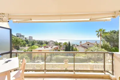 a balcony with a view of the ocean at 1-Br apartment calm sea view pool and parking garage in Cannes