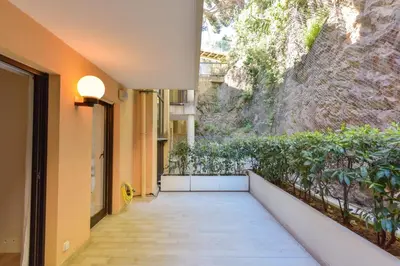 a hallway of a building with a wall with plants at 1-Br apartment calm sea view pool and parking garage in Cannes