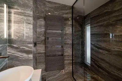 a bathroom with a glass shower with a toilet at Sumptuous terrace apartment - Cannes - Sea view in Cannes