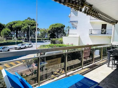 a balcony with a view of a street at Cannes Palm Beach in Cannes