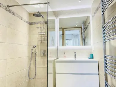 a bathroom with a sink and a shower at Cannes Palm Beach in Cannes