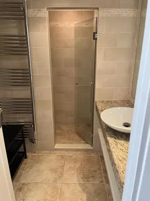 a bathroom with a shower and a sink at Cannes Palm Beach in Cannes