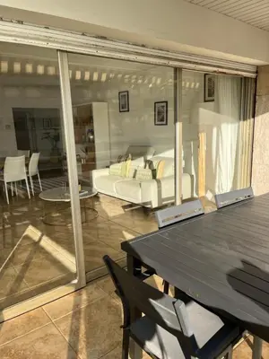 a living room with a couch and a table at Cannes Palm Beach in Cannes