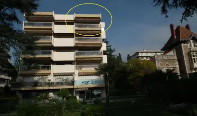 a building with a yellow circle on the side of it at Apartment Montmorency in Cannes