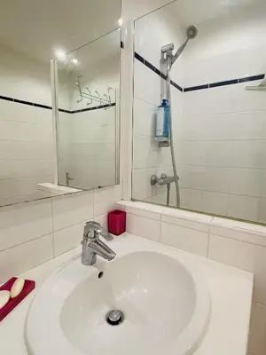 a bathroom with a sink and a shower at Studio proche centre FARN4 in Cannes