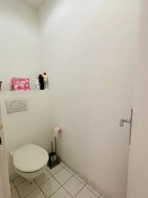 a bathroom with a white toilet in a room at Studio proche centre FARN4 in Cannes