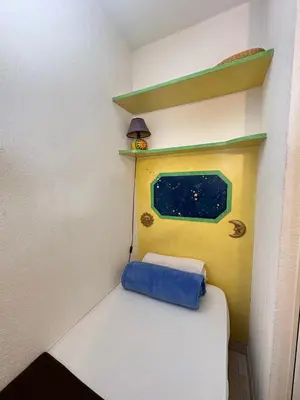 a small room with a bed and a window at Charming Apartment in Cannes 10-min to beach in Cannes