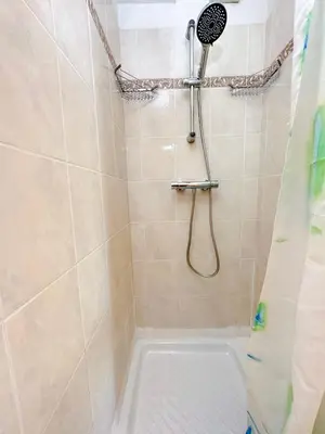 a shower with a shower head and a toilet in a bathroom at Charming Apartment in Cannes 10-min to beach in Cannes