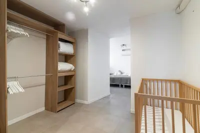 a room with a staircase and a room with a bed at BEAU REZ DE JARDIN- Cannes Suquet - Clim- Calme - Lumineux- 15 minutes Palais des Festival in Cannes