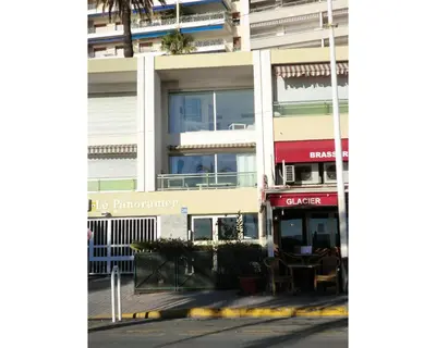 an empty street in front of a building at Le Panoramer Sea View in Cannes