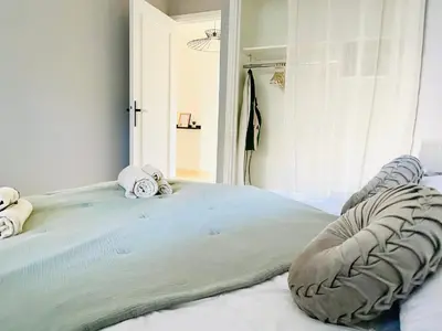 a bedroom with a large bed with a window at Appartement 2 pièces à Cannes in Cannes