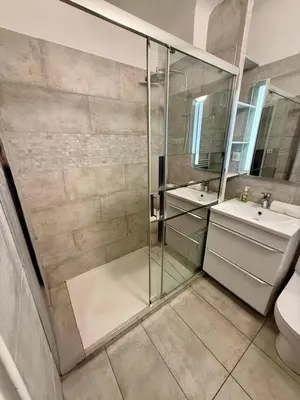 a bathroom with a shower and a toilet and a sink at Studio Vidal in the city center of Cannes with AC in Cannes