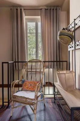 a bedroom with a bed and a chair and a window at Cannes La Vie - Palais, plages, clim, terrasse in Cannes