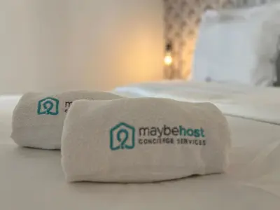 a hotel room with two beds with a towel at C003 Cosy a 200 m du Palais plein centre Cannes in Cannes
