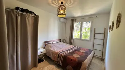 a small bedroom with a bed and a window at B023 Tres bel appartement proche de la mer a Cannes in Cannes