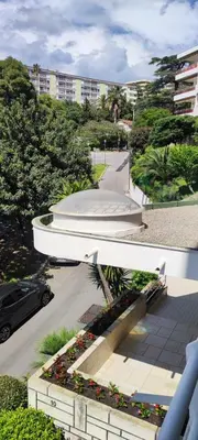 a view of a building with a bench and a street at Cannes Studio near Croisette Plage in Cannes