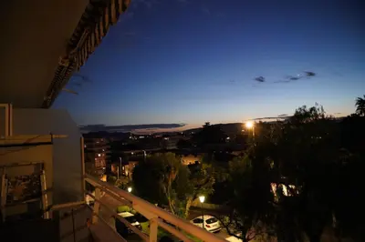 a view of a city at night from a balcony at Cannes Studio near Croisette Plage in Cannes