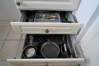 a drawer filled with pots and pans in a kitchen at Cannes Studio near Croisette Plage in Cannes