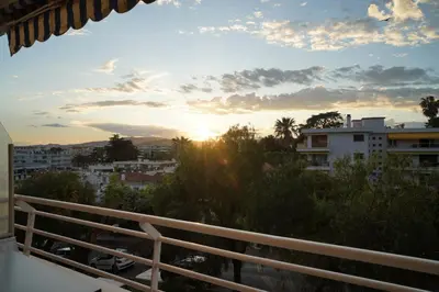 a view of the sunset from a balcony at Cannes Studio near Croisette Plage in Cannes