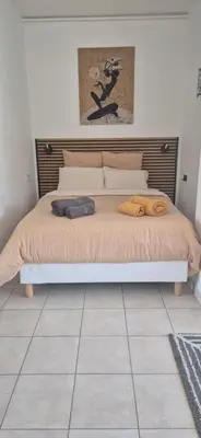 a bed with two pillows on it in a bedroom at Cannes Studio near Croisette Plage in Cannes