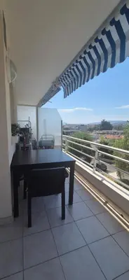 a table sitting on top of a balcony with a view at Cannes Studio near Croisette Plage in Cannes